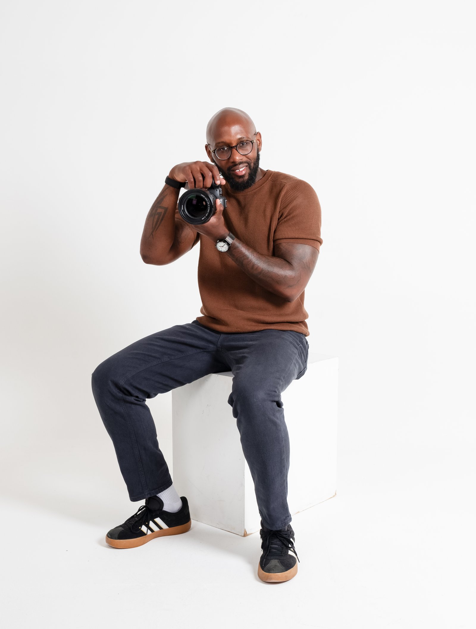 Kyle, the photographer behind Tunnel Vizuals, holding his camera